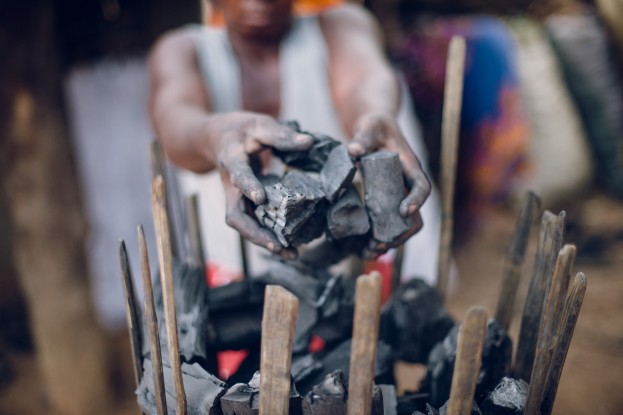 Josephine Lungu, 47 years old, packing charcoal in Zuwalinyenga village. Zambiaâ??s forests risk becoming deserts in the next fifteen years going by the current rate of deforestation. 90 percent of the population use charcoal related sources of energy, thereby making charcoal burning a lucrative business venture and a major source of livelihoods. Ollivier Girard/CIFOR