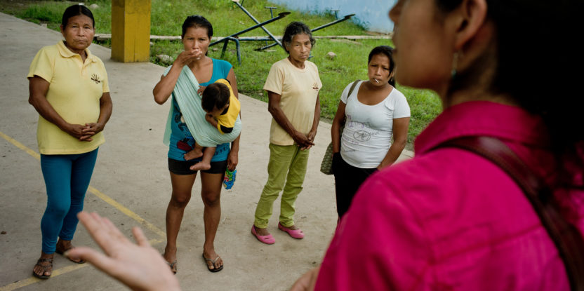 Center for International Forestry Research (CIFOR) scientist Elena Mejia talks to some Kichwa women. After CIFOR will meet with the rest of the villagers to inform them of CIFOR's findings, Napo Province, Ecuador.