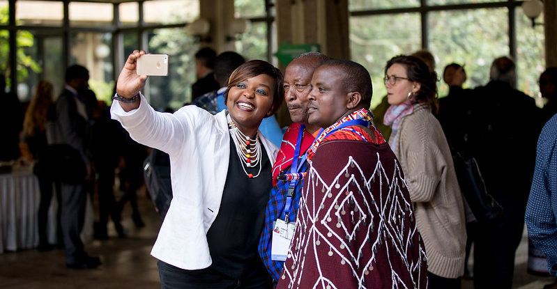 Three people take a selfie