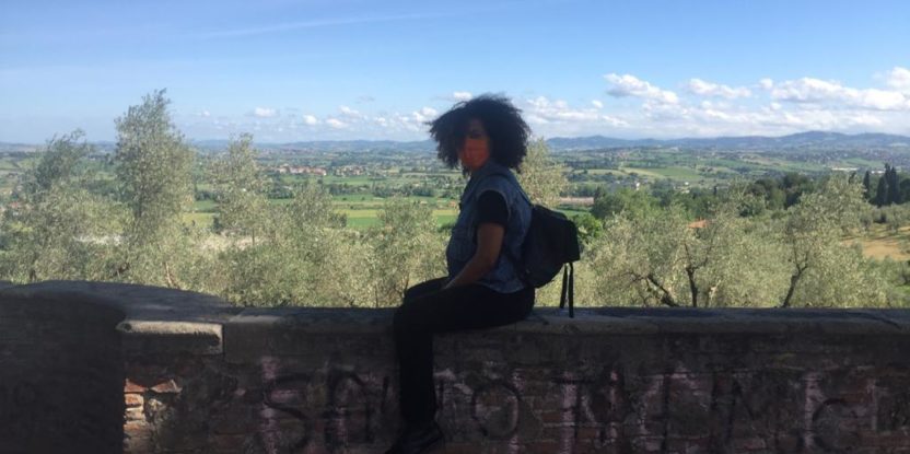 A woman sitting on a wall