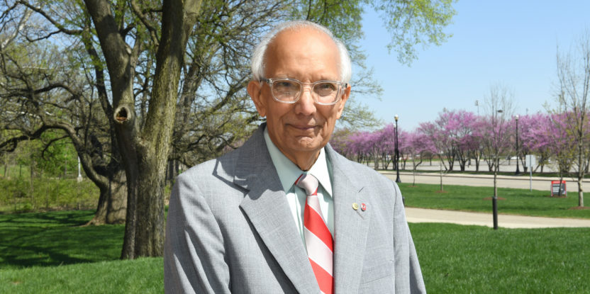 Rattan Lal stands in front of a tree