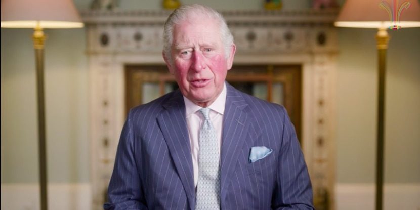 Britain's Prince Charles sits in a drawing room facing the camera